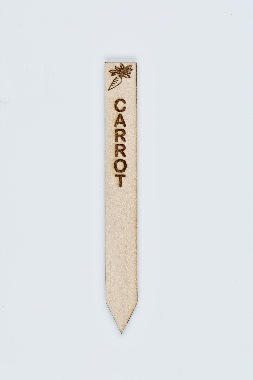 Wooden plant label with 'CARROT' text and carrot icon on a light gray background